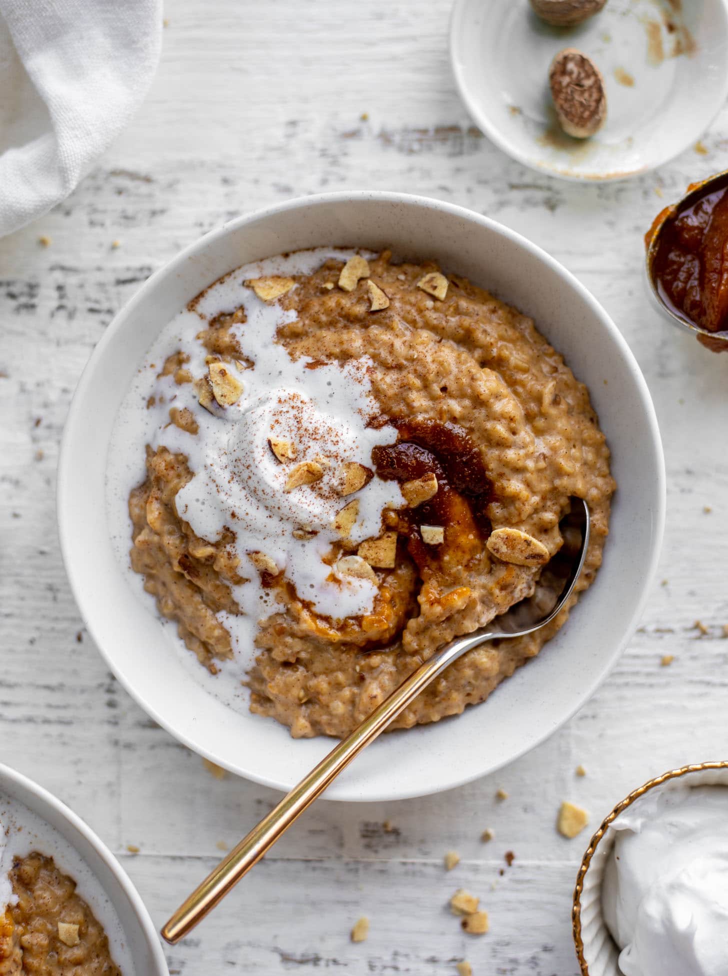 pumpkin pie oatmeal with coconut cream and almonds