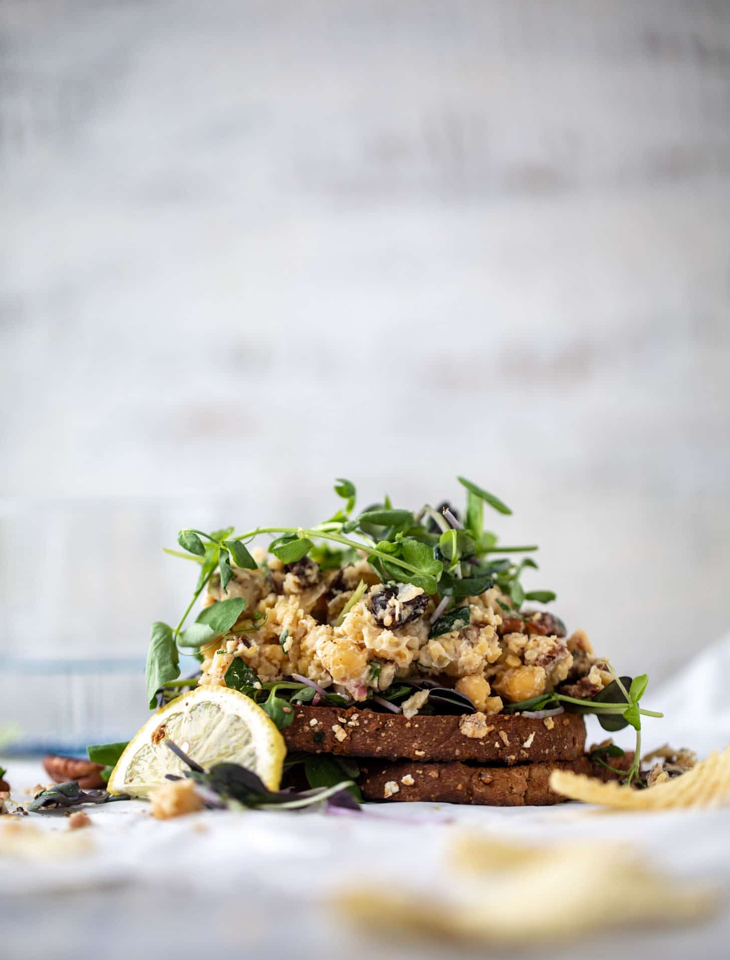 smashed chickpea salad on toast with micro greens