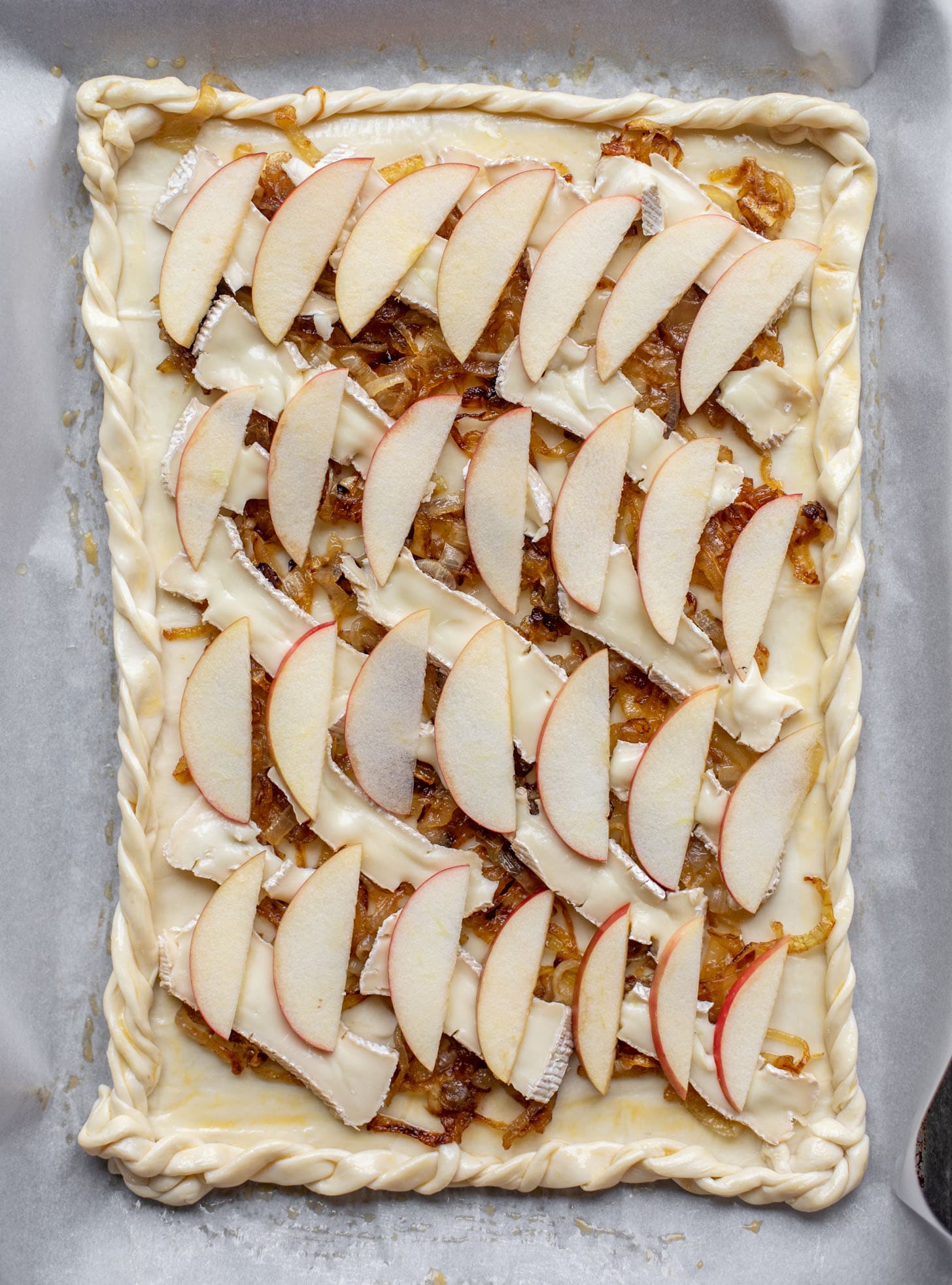 caramelized onion, apple and brie puff pastry tart