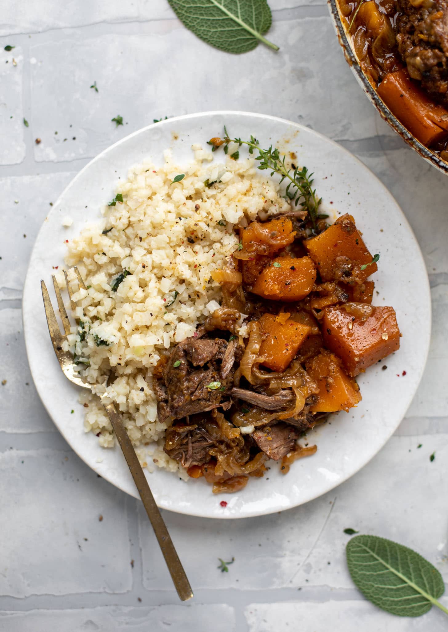 cider braised pot roast with caramelized onions, butternut squash and cauliflower rice