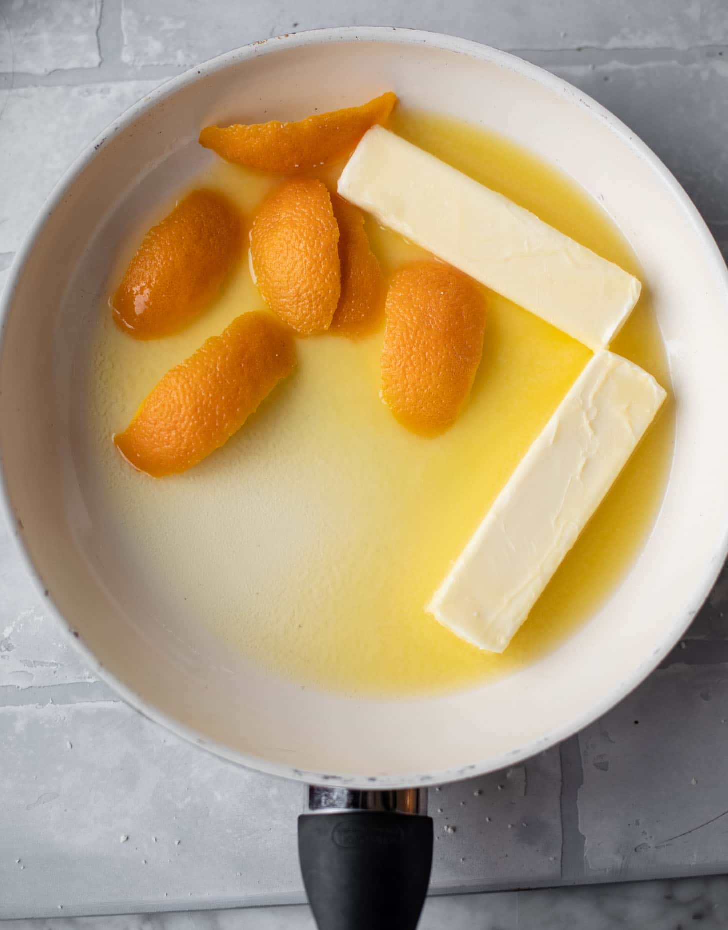melting butter and orange rind