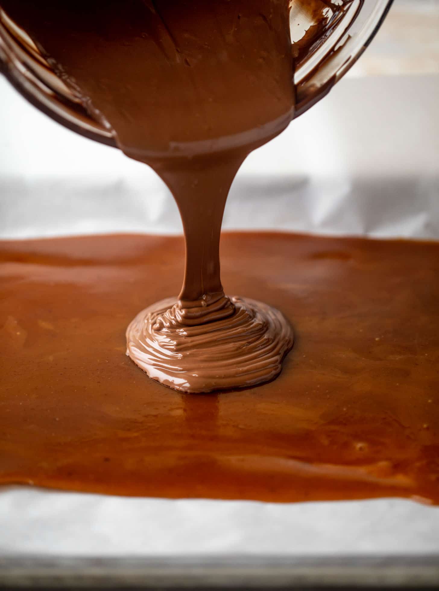 pouring chocolate onto toffee