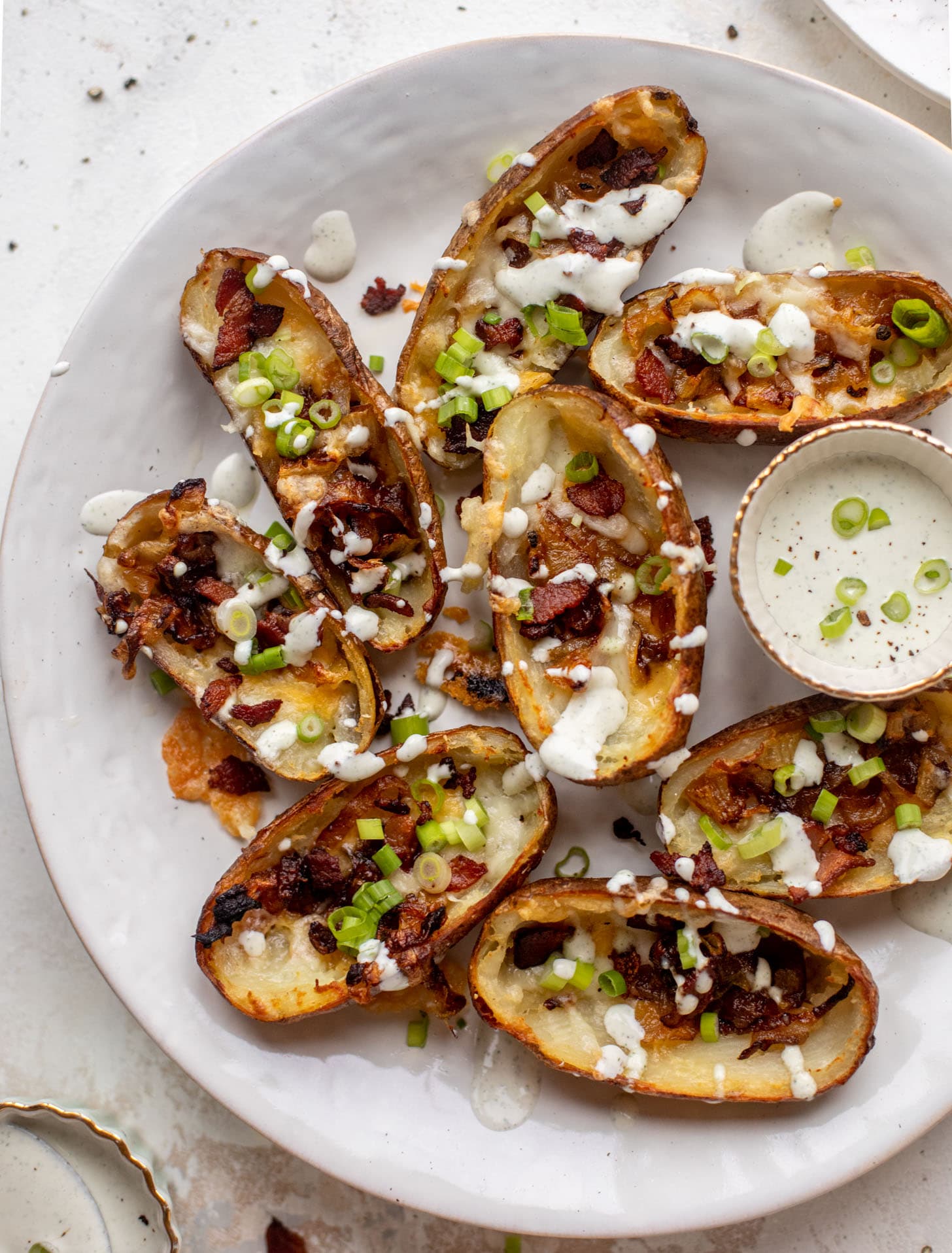 smoked cheddar and caramelized onion potato skins with ranch