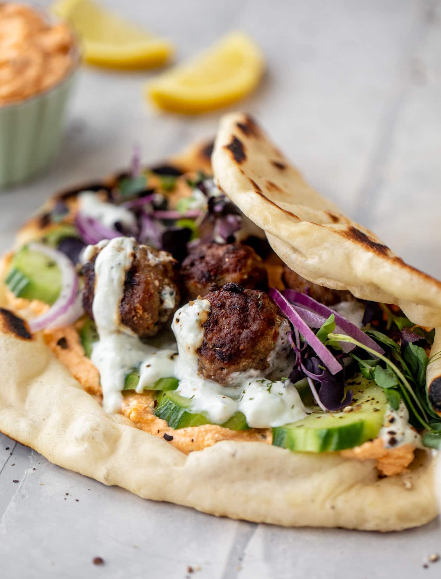 chicken meatball pitas with roasted red pepper whipped feta