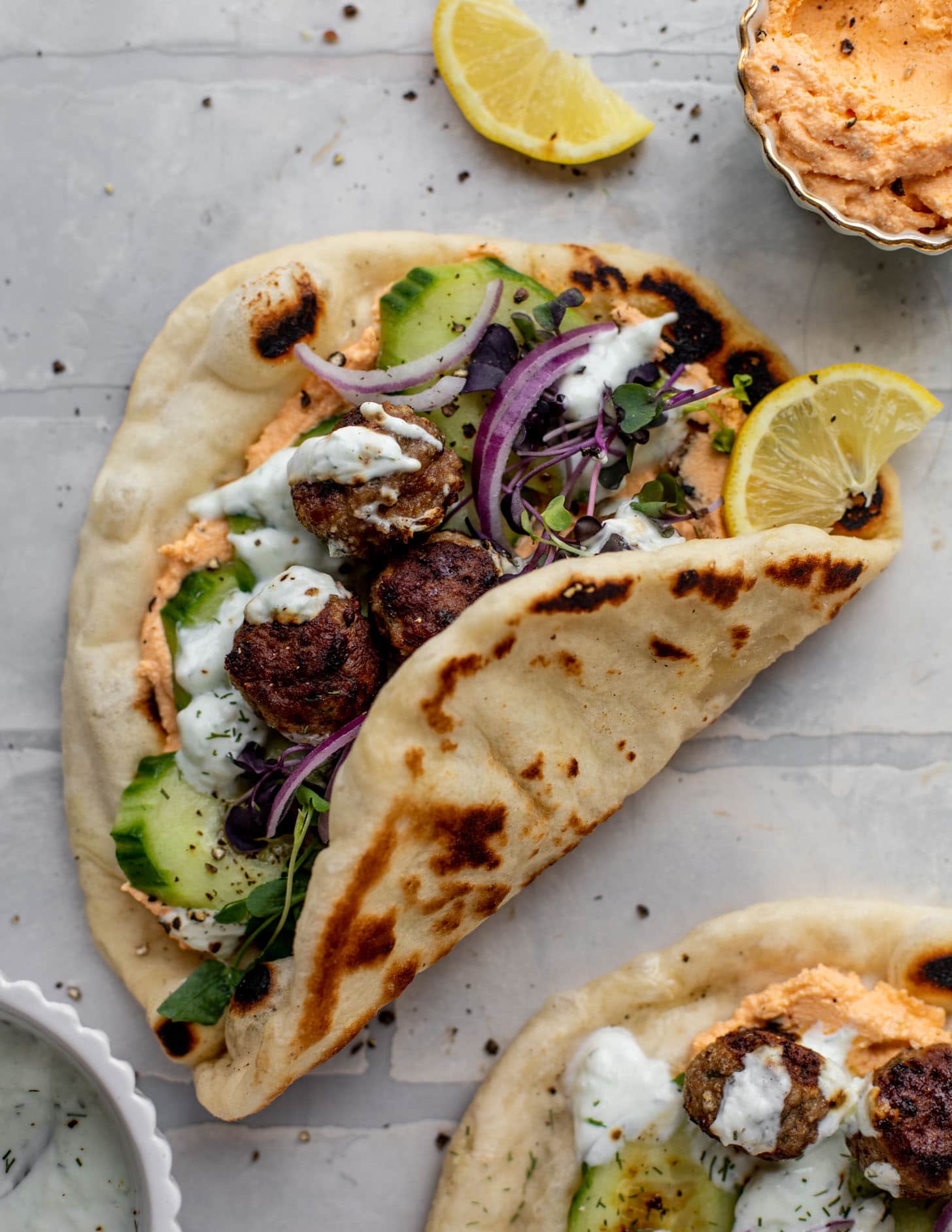 chicken meatball pitas with roasted red pepper whipped feta