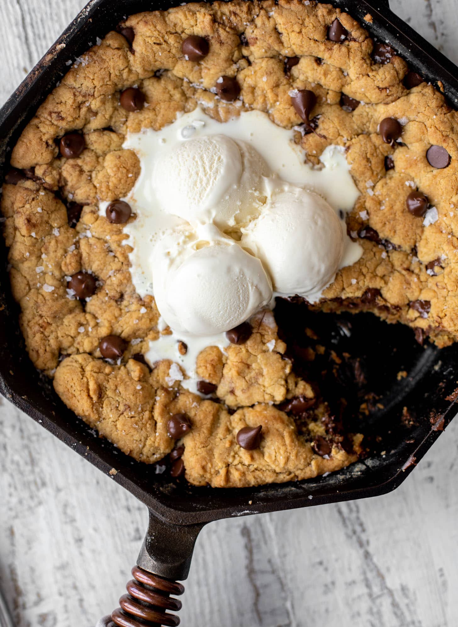 chewy chocolate chip skillet cookie topped with ice cream