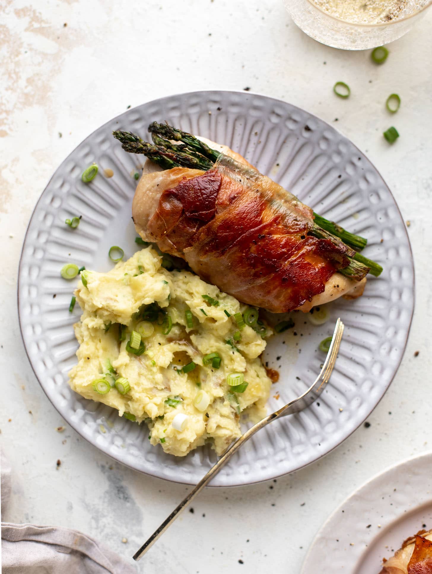 prosciutto wrapped asparagus stuffed chicken with scallion smashed potatoes