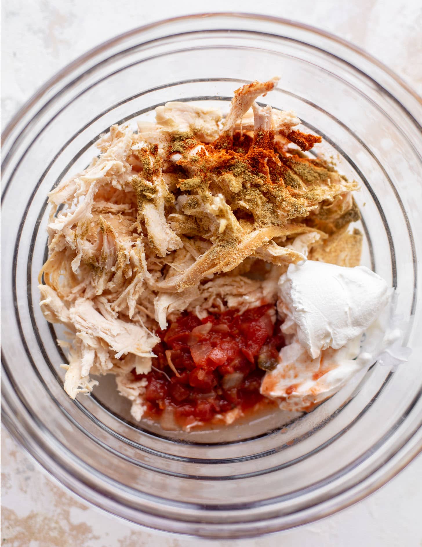 shredded chicken with salsa, spices, sour cream