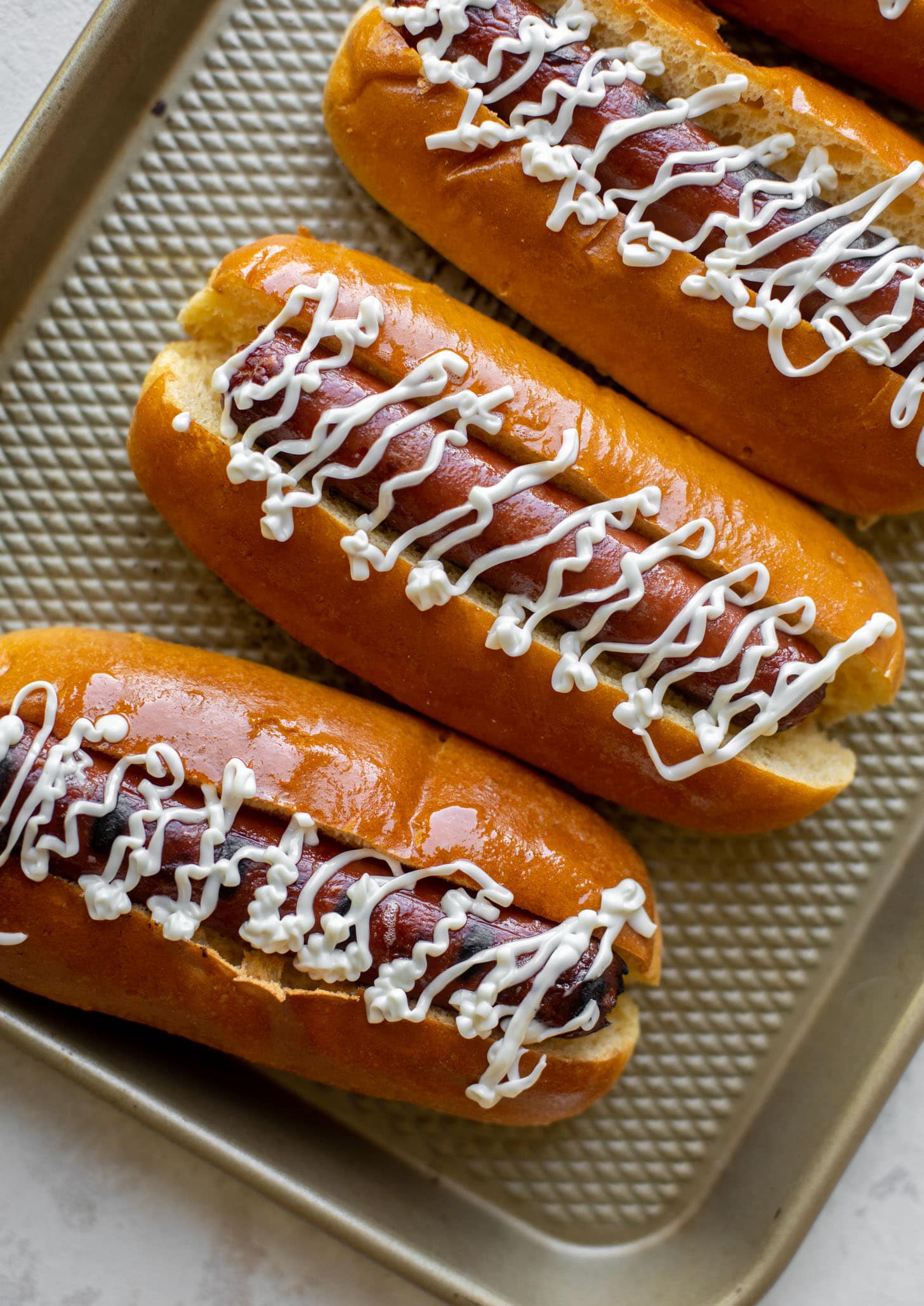 grilled hot dogs with mayo drizzle