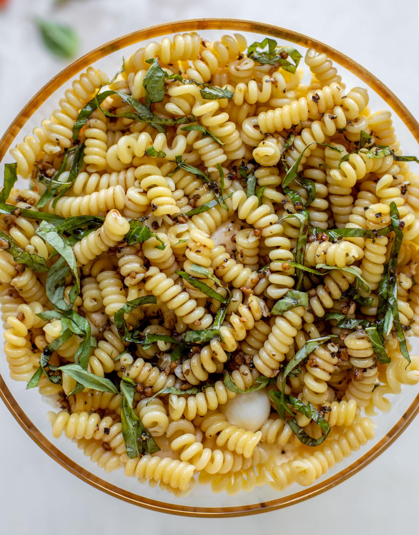 pasta and fresh basil with dressing