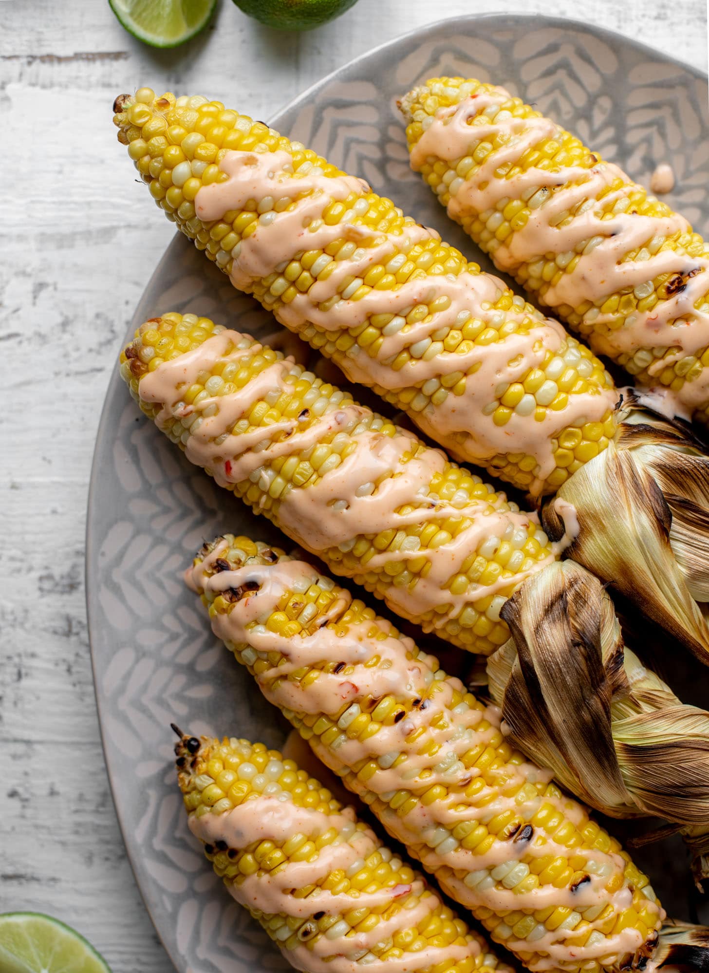 grilled corn drizzled with bang bang sauce