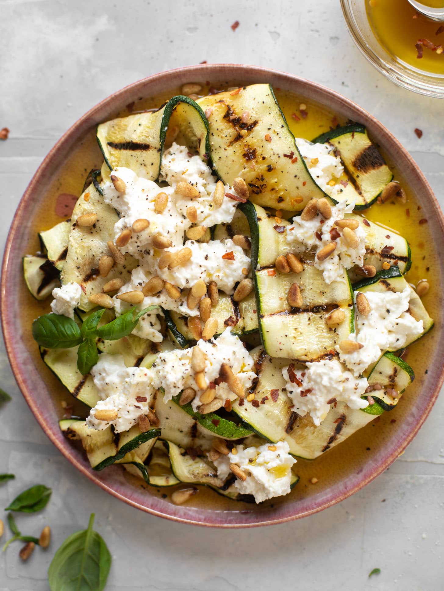 grilled zucchini with burrata and pine nuts