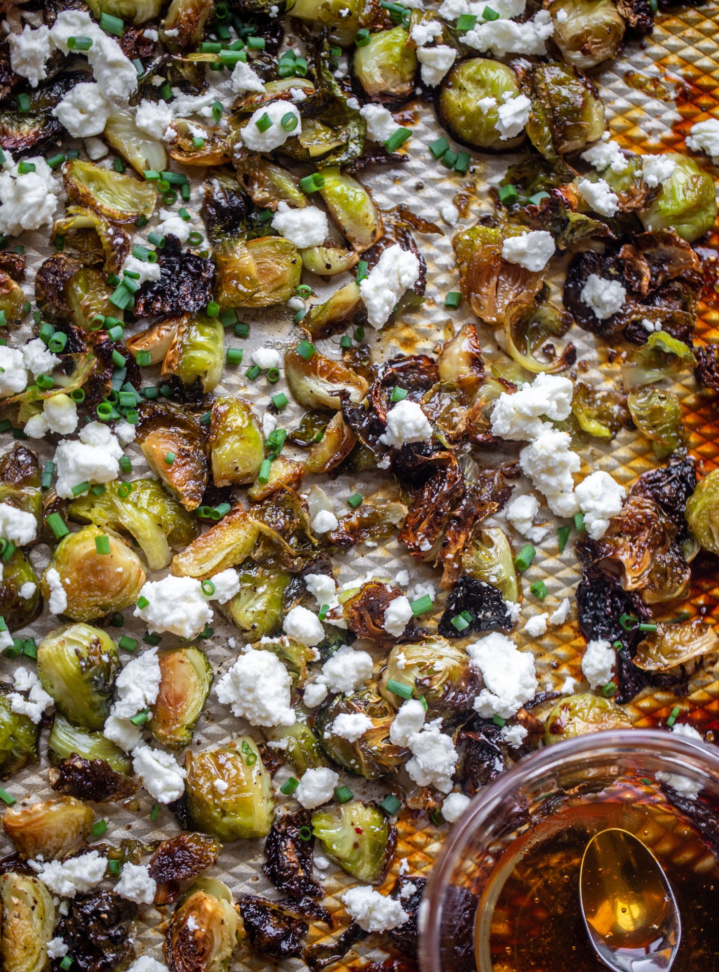 hot honey roasted brussels sprouts on a sheet pan