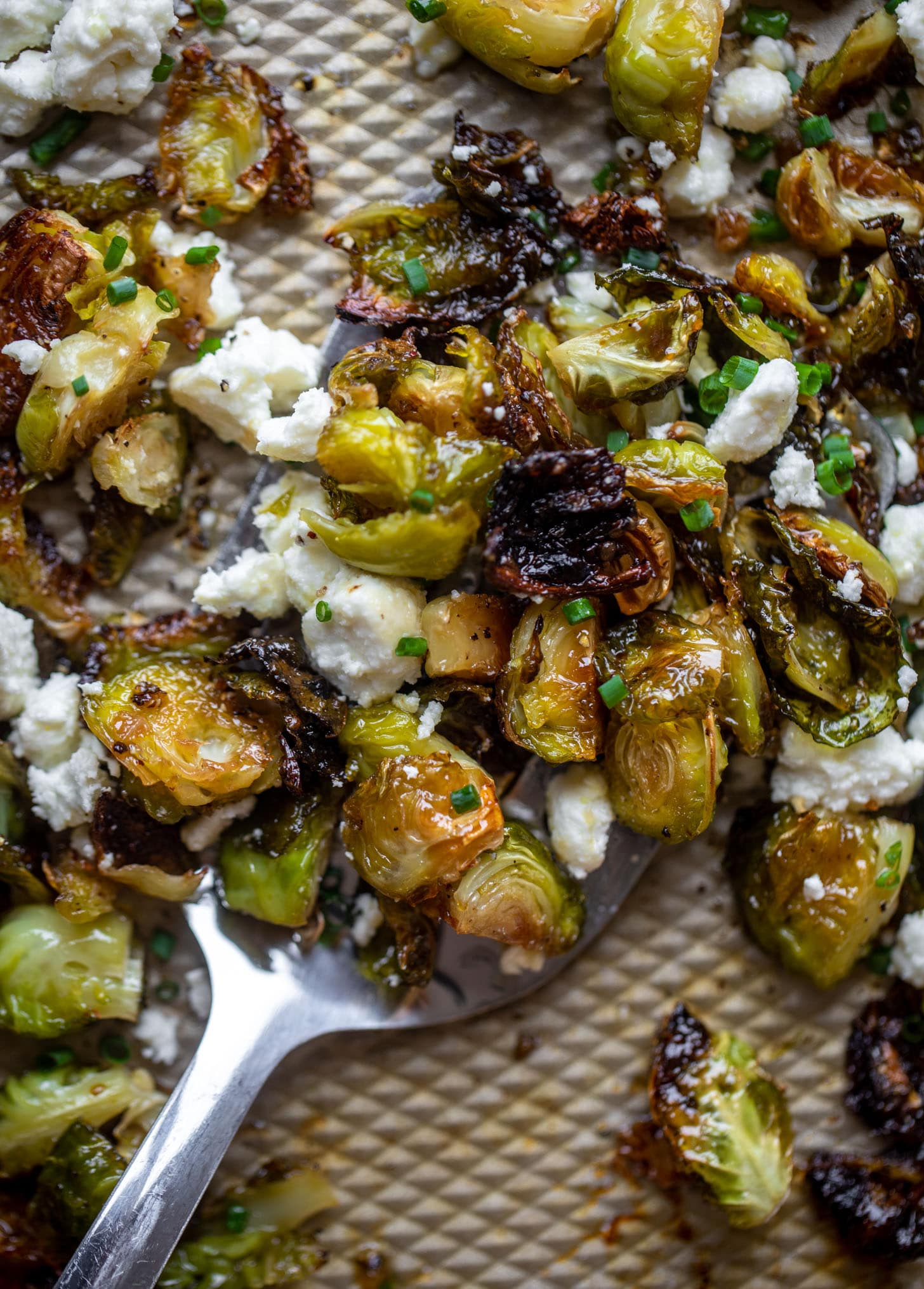 hot honey roasted brussels sprouts on a sheet pan