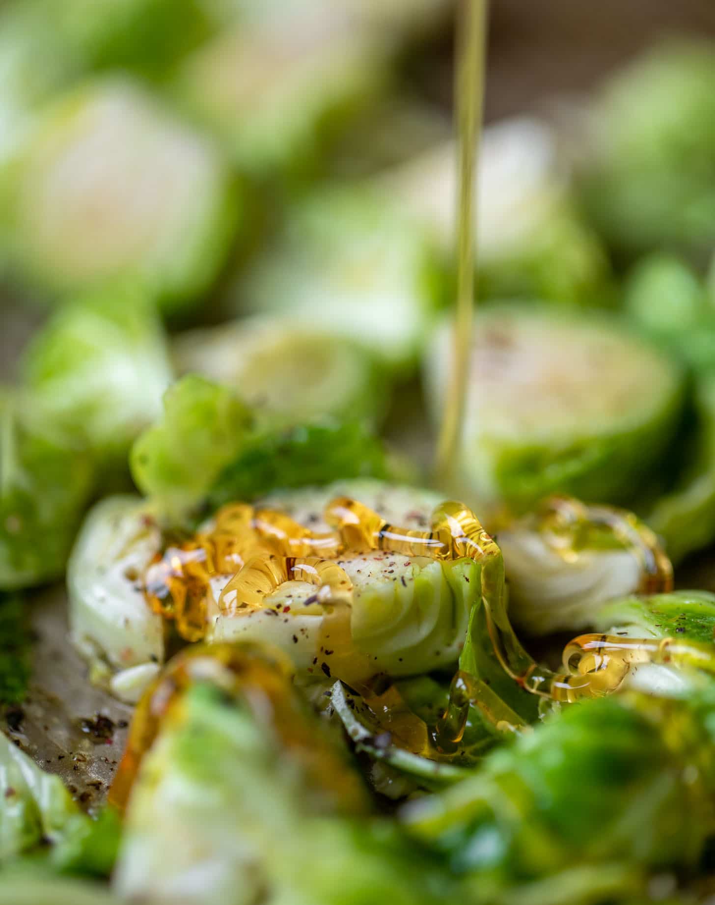 drizzling hot honey on brussels sprouts
