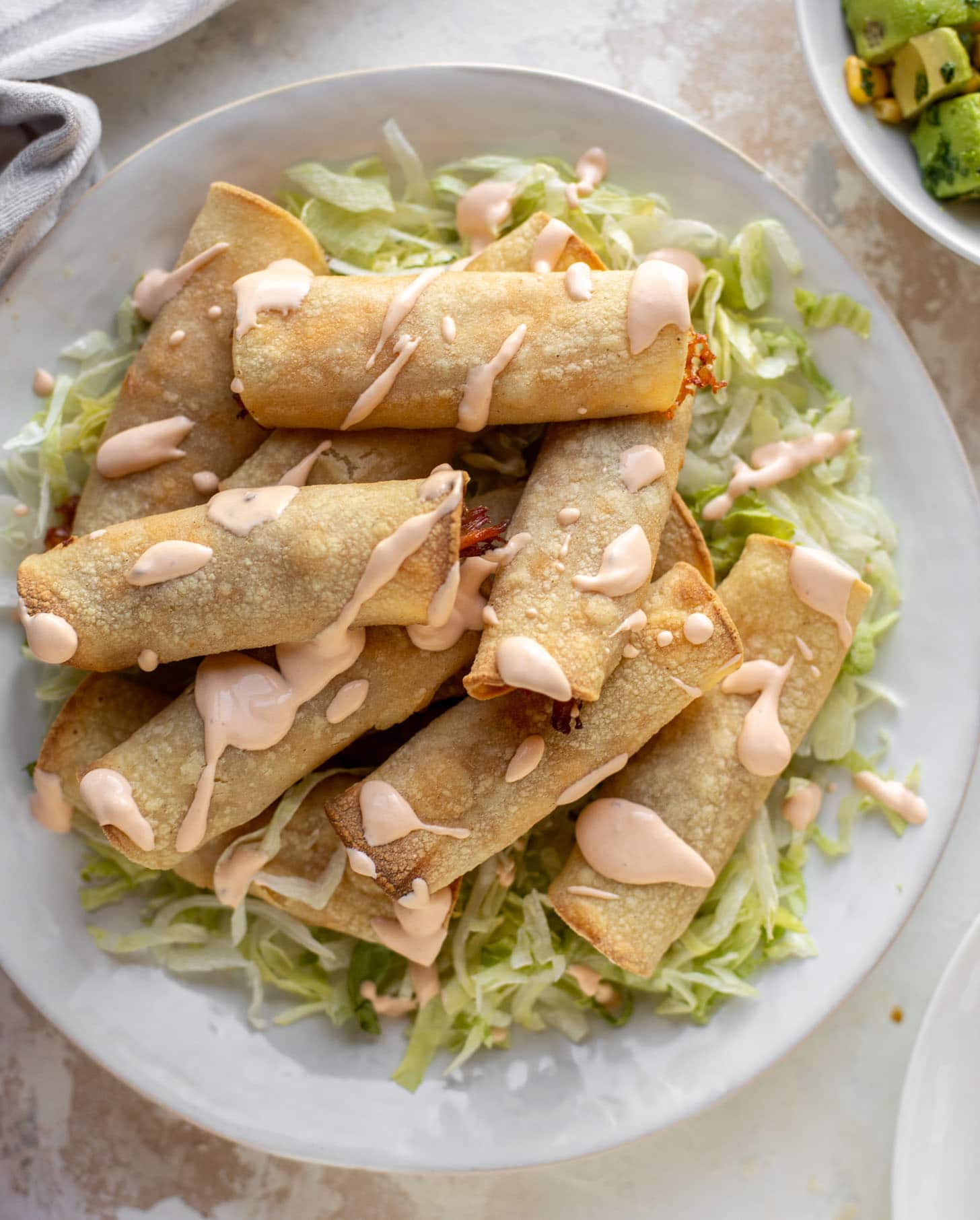 chipotle cheddar baked pork taquitos with crema