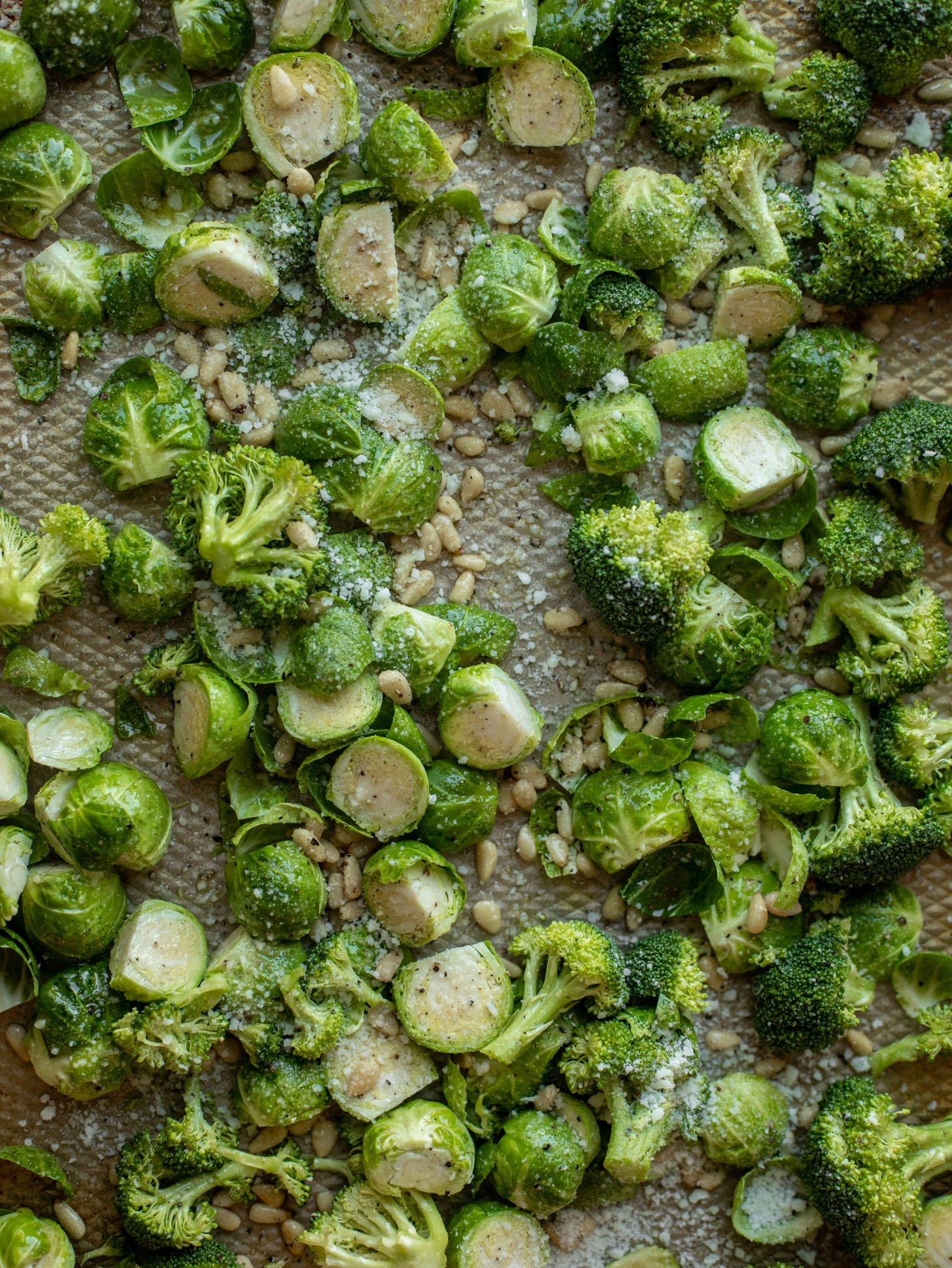 broccoli and brussels sprouts on a baking sheet