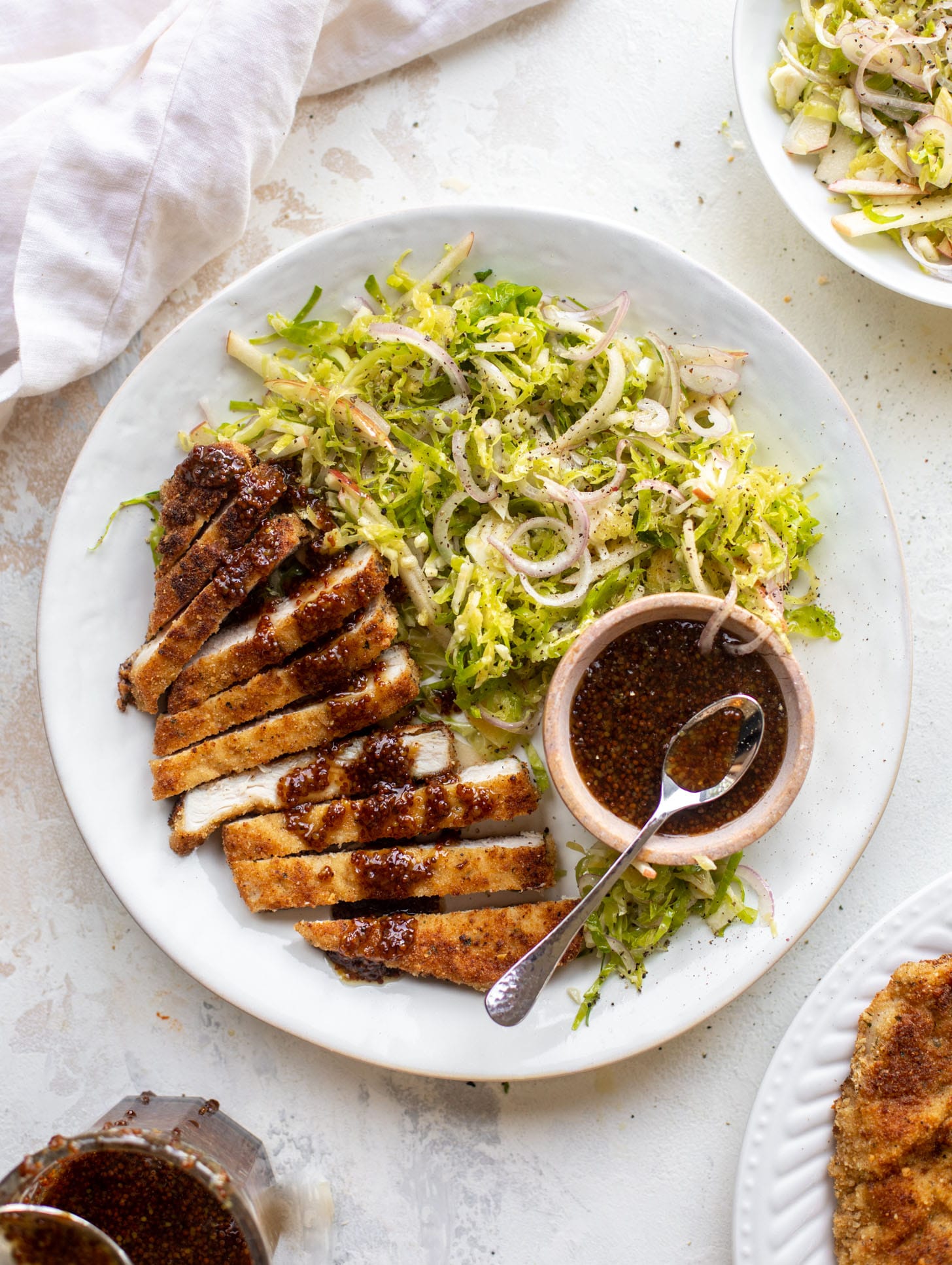 pork schnitzel with carolina gold BBQ sauce & brussels sprouts slaw
