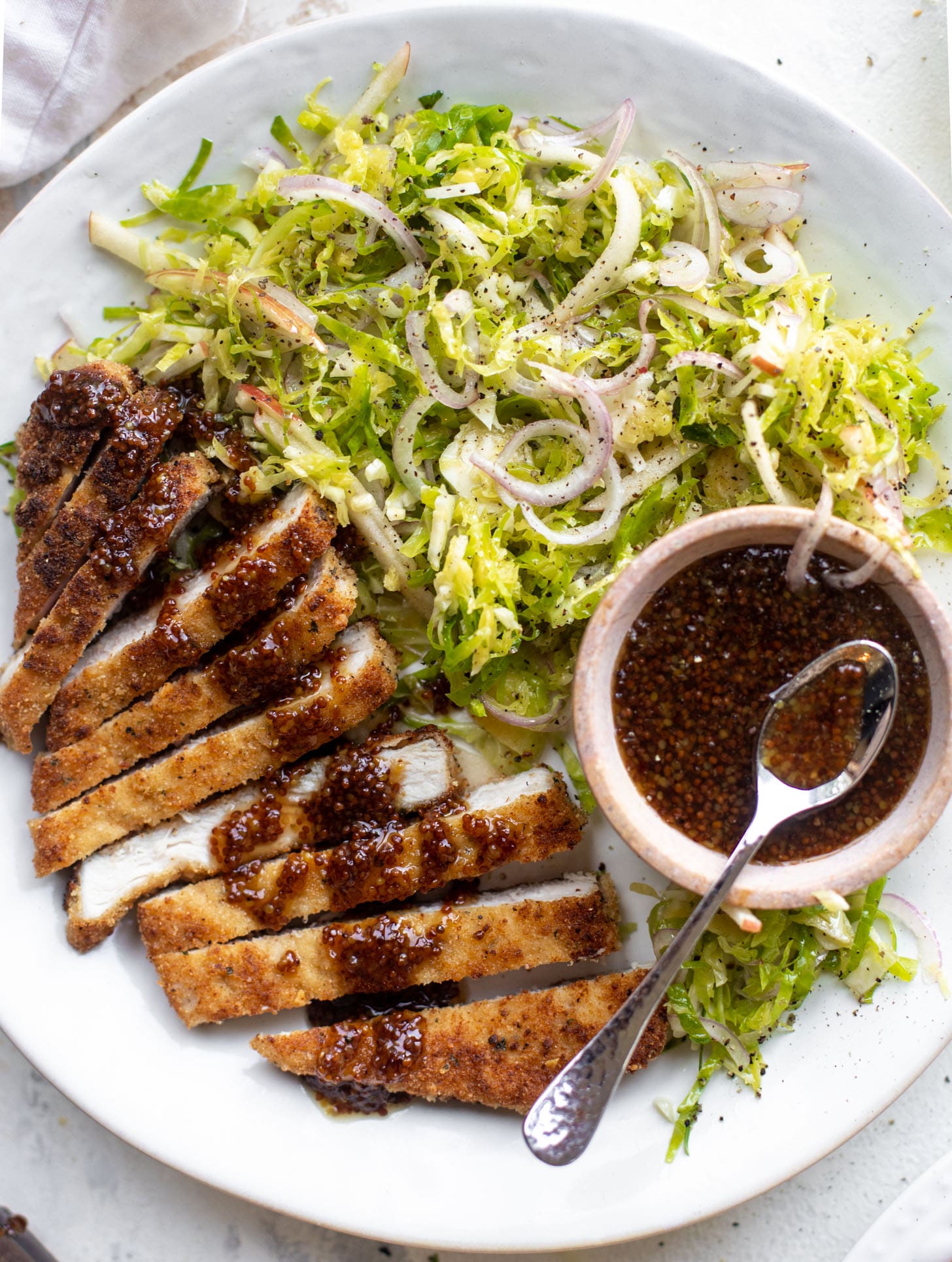 pork schnitzel with carolina gold BBQ sauce & brussels sprouts slaw