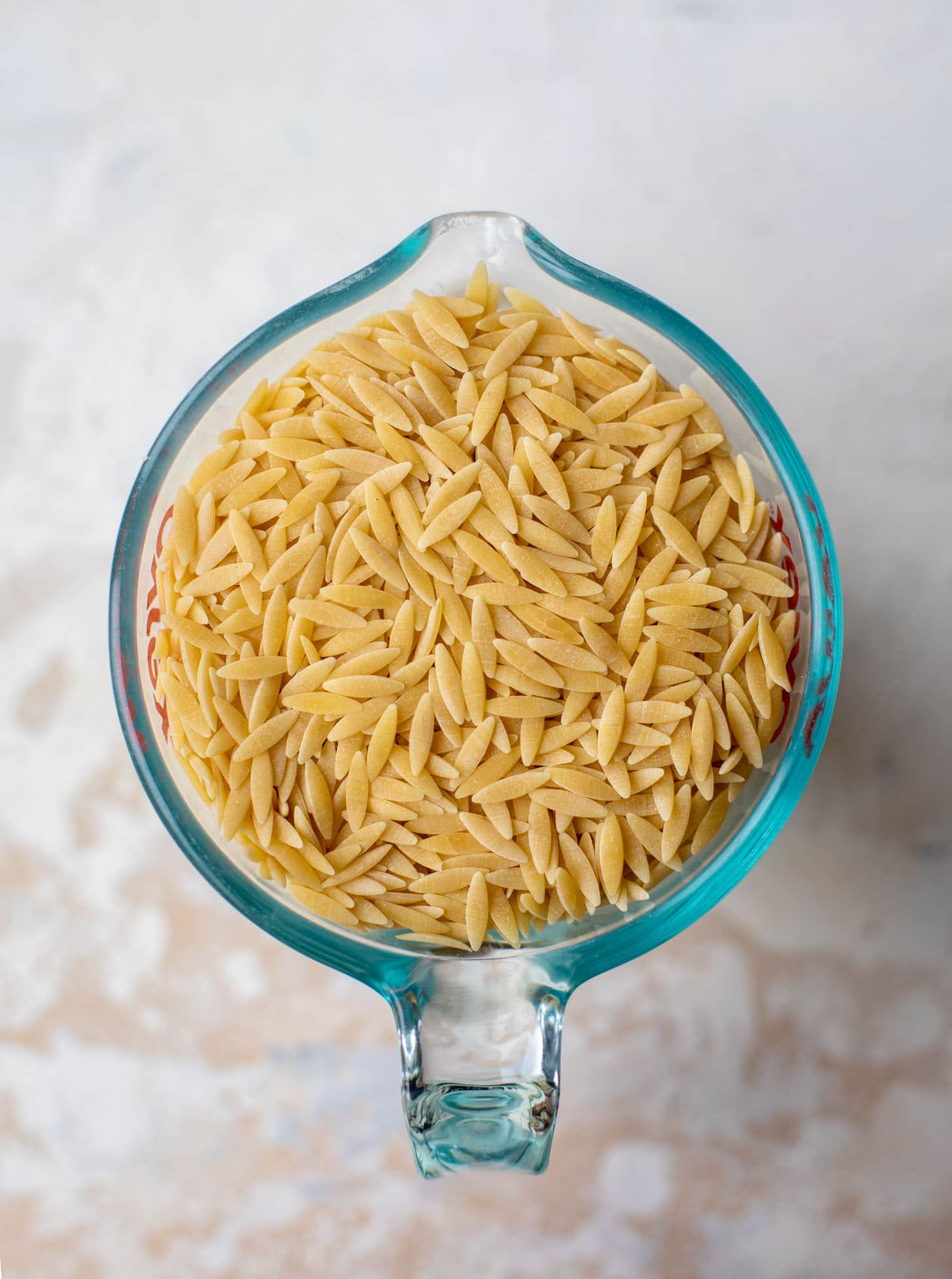 orzo pasta in a measuring cup