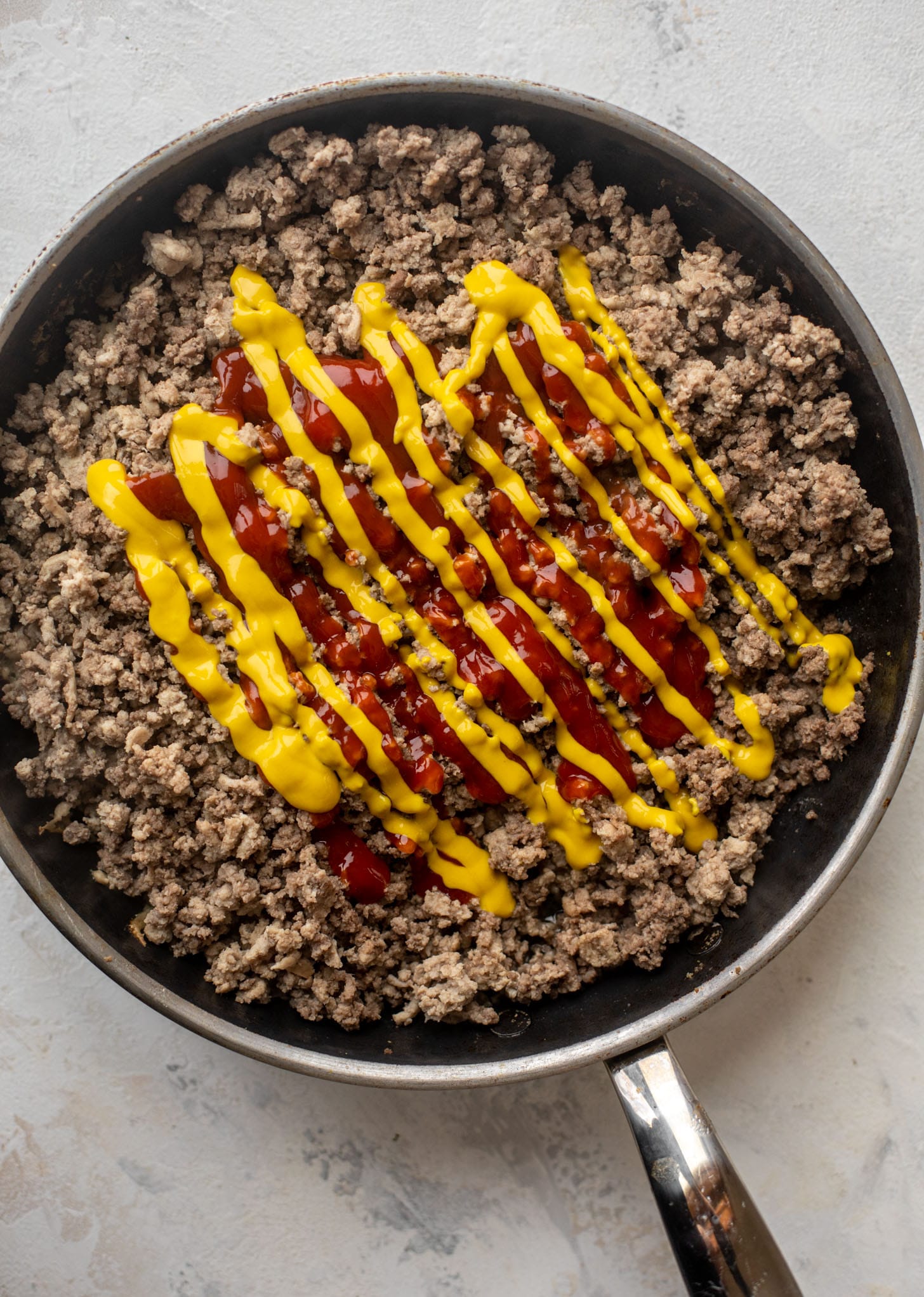 ground beef with ketchup and mustard