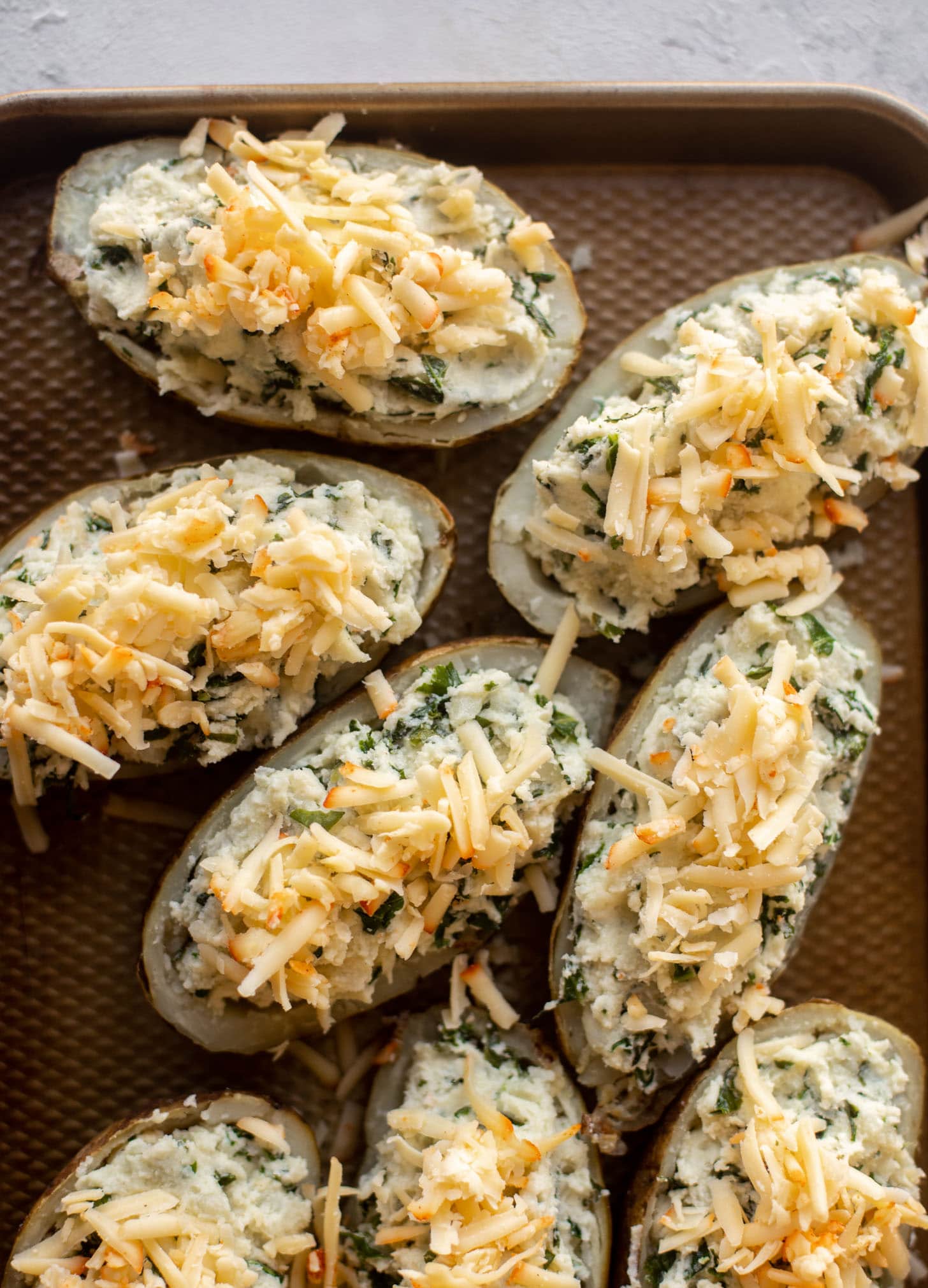 kale and smoked cheddar twice baked potatoes before baking