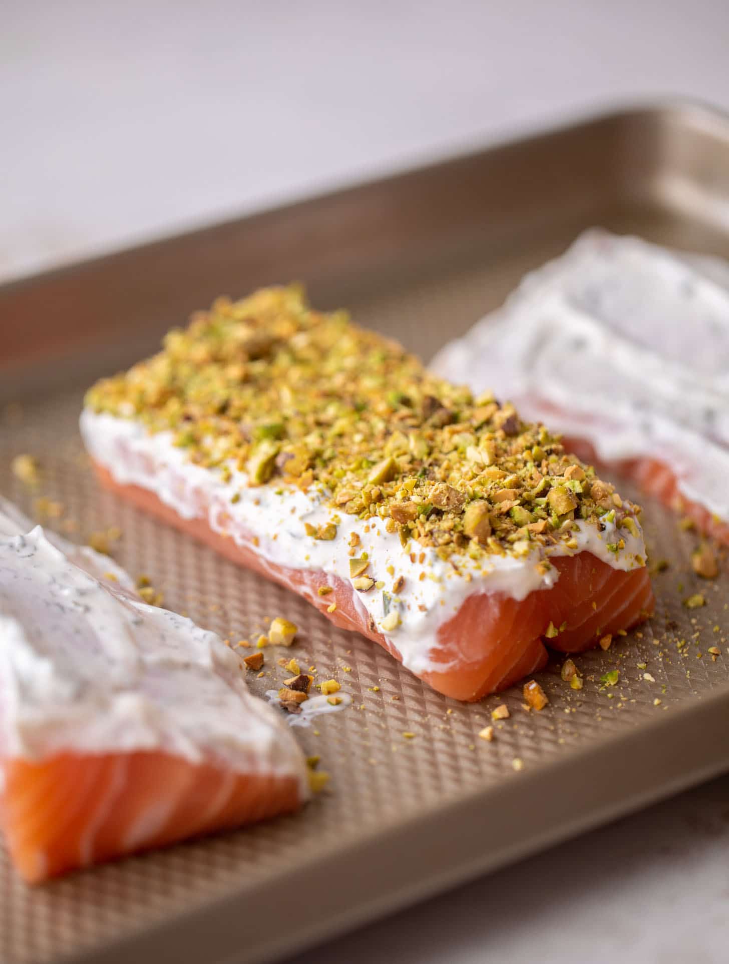 salmon with herb yogurt and pistachios