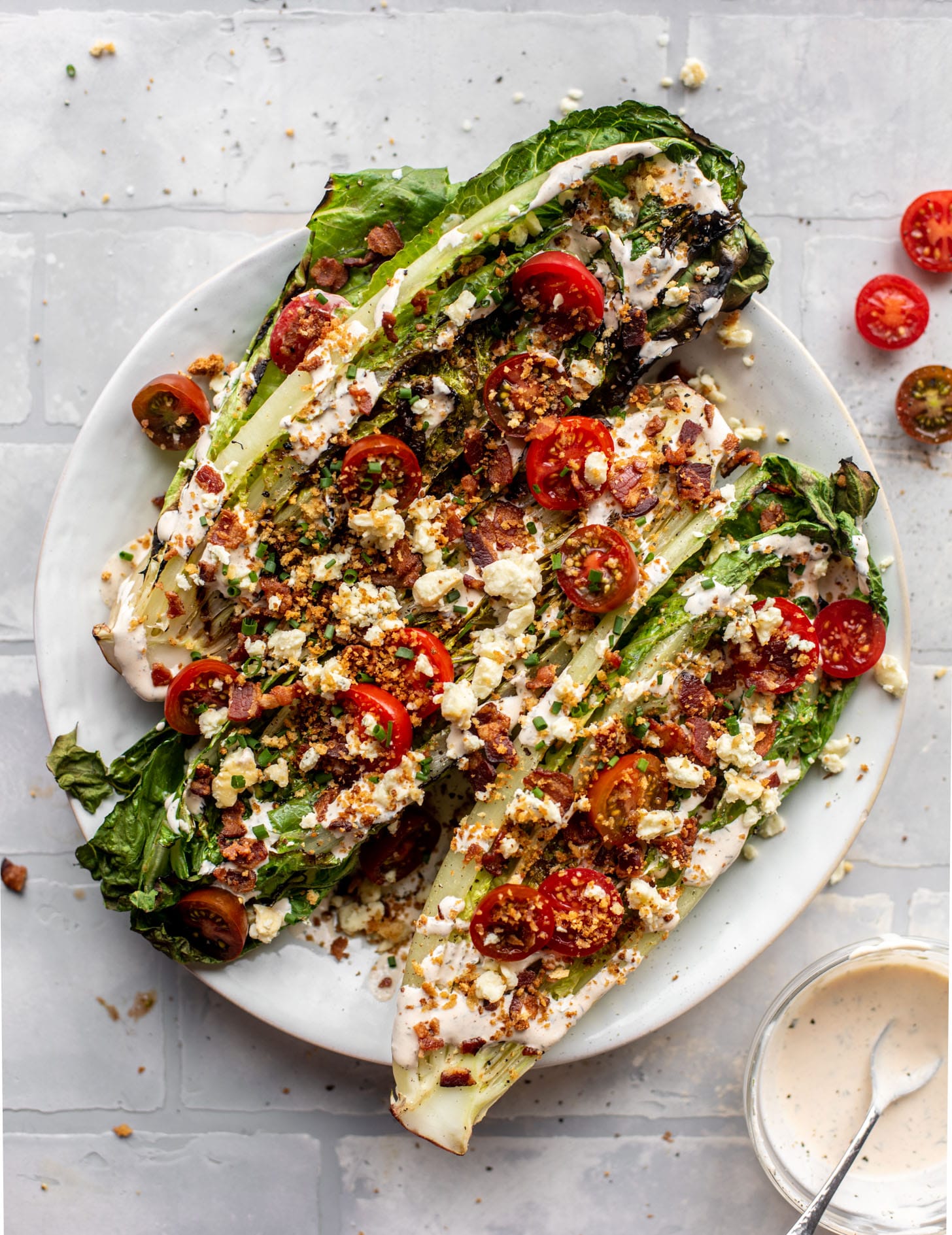 grilled romaine salads with tomatoes, bacon and ranch