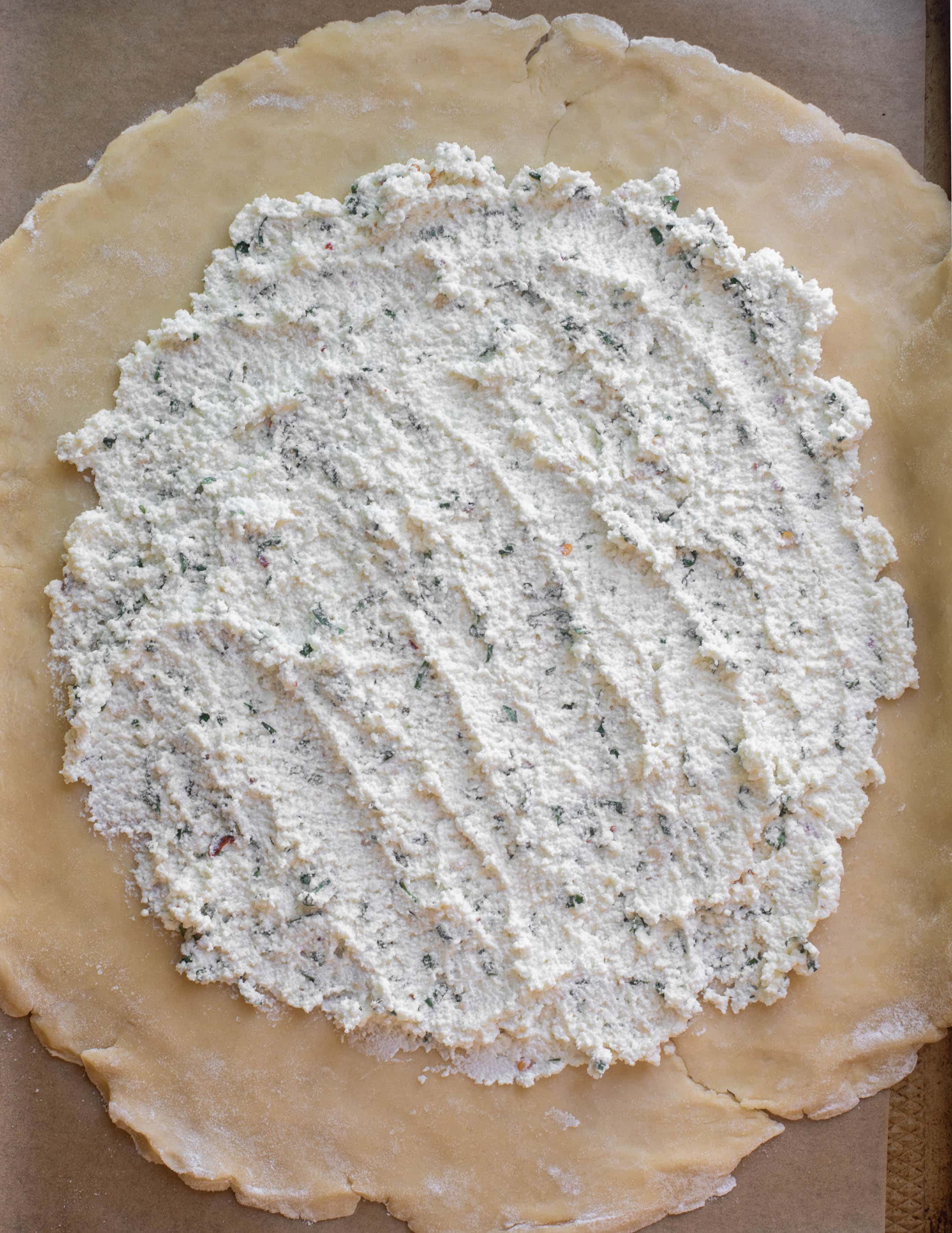 pie crust spread with ricotta cheese