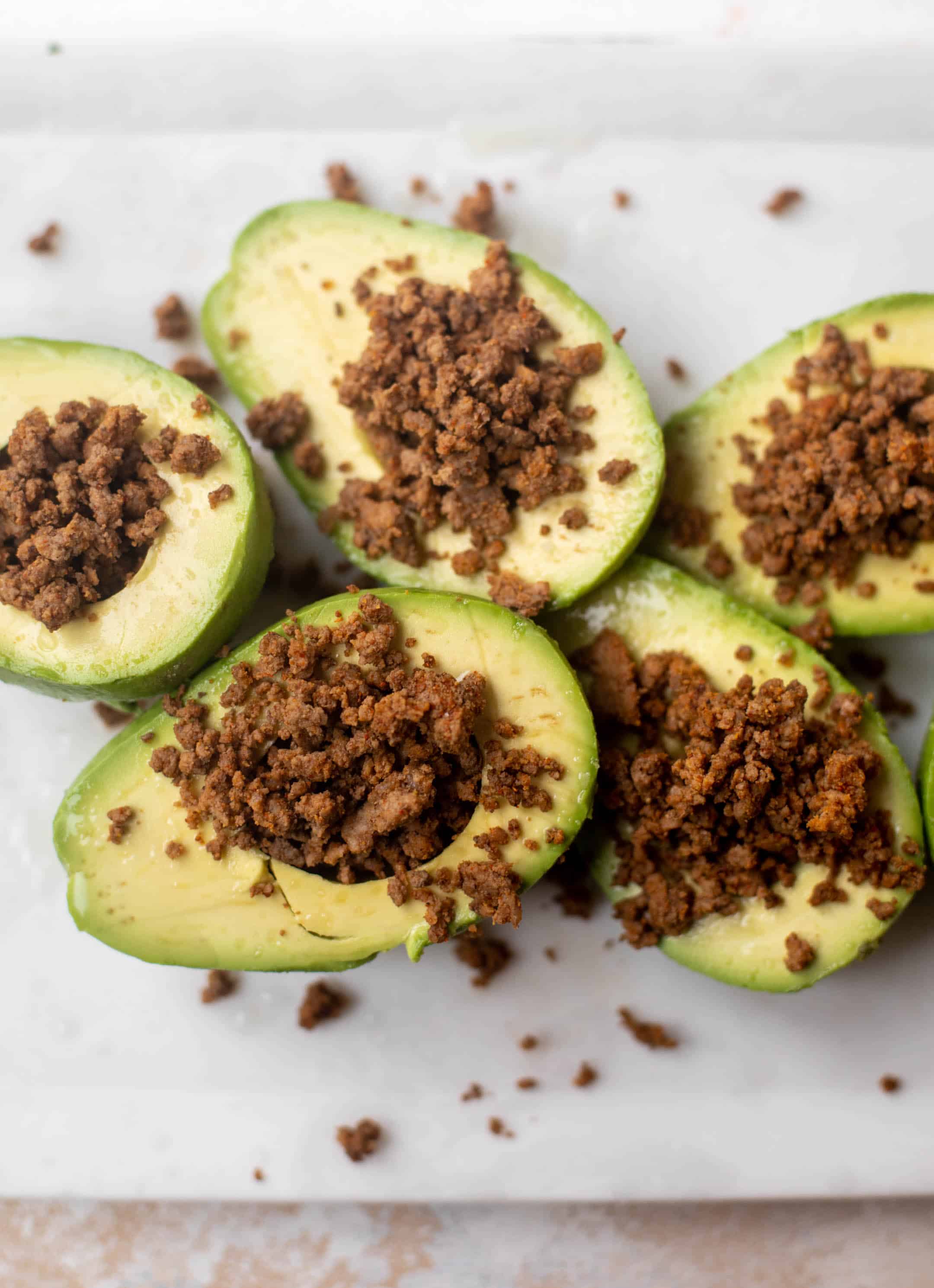sliced avocados with taco meat