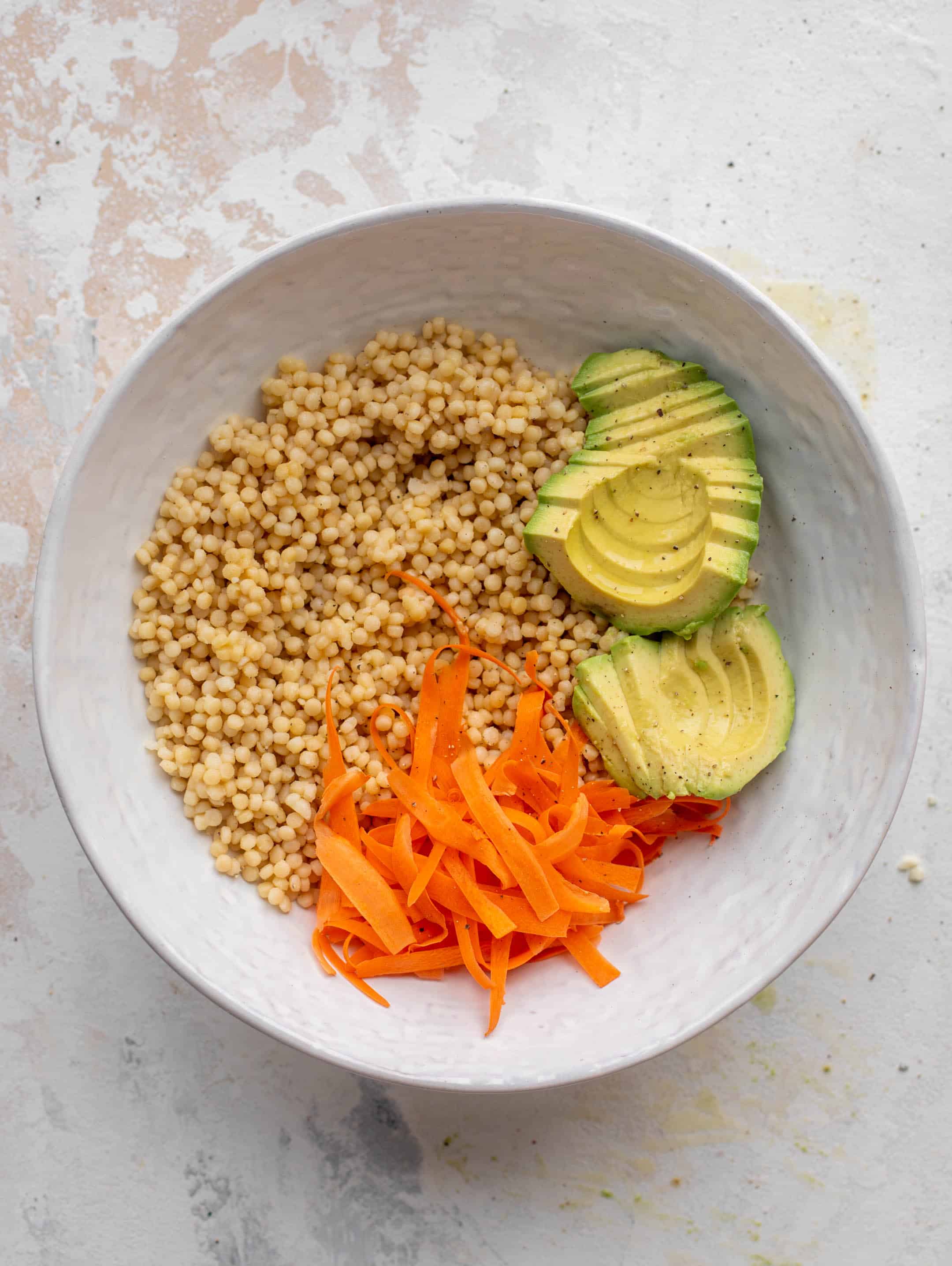 couscous with carrots ribbons and avocado
