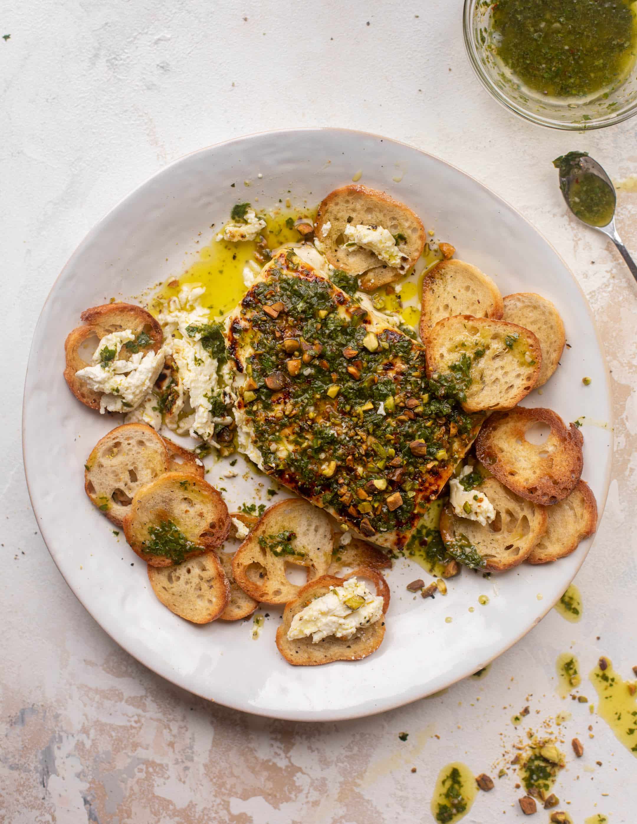 grilled feta with pistachios and chimichurri