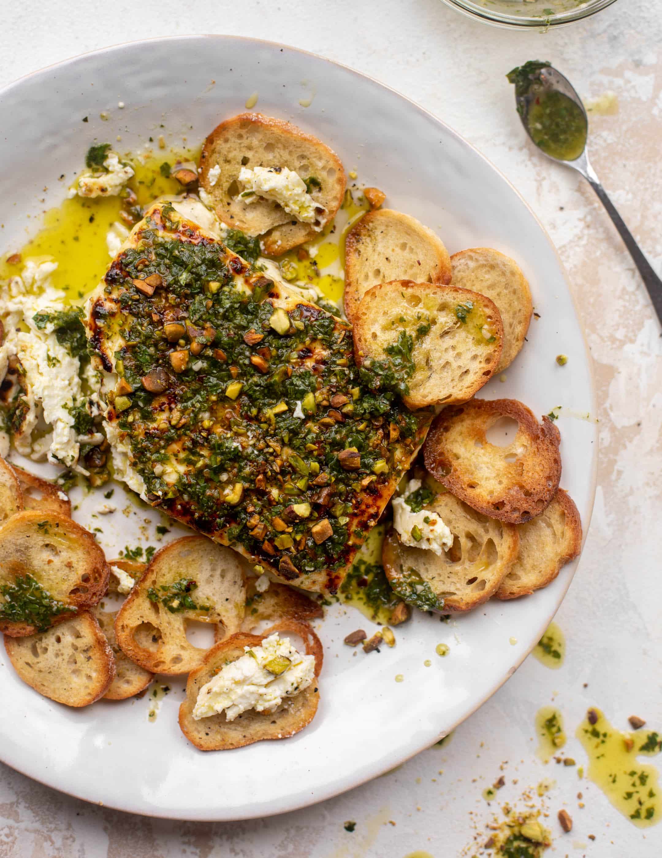 grilled feta with pistachios and chimichurri