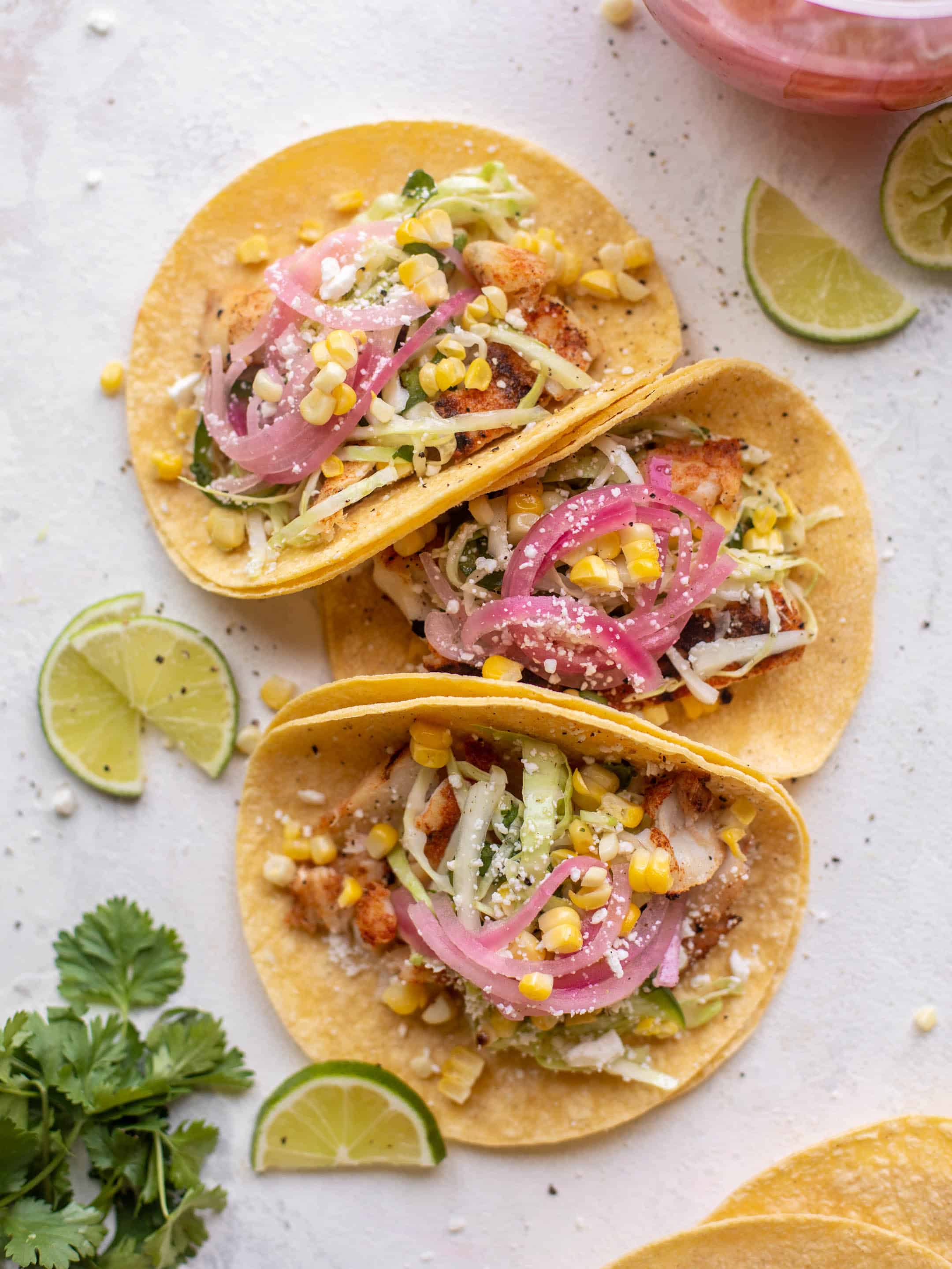 grilled fish tacos with jalapeño corn slaw