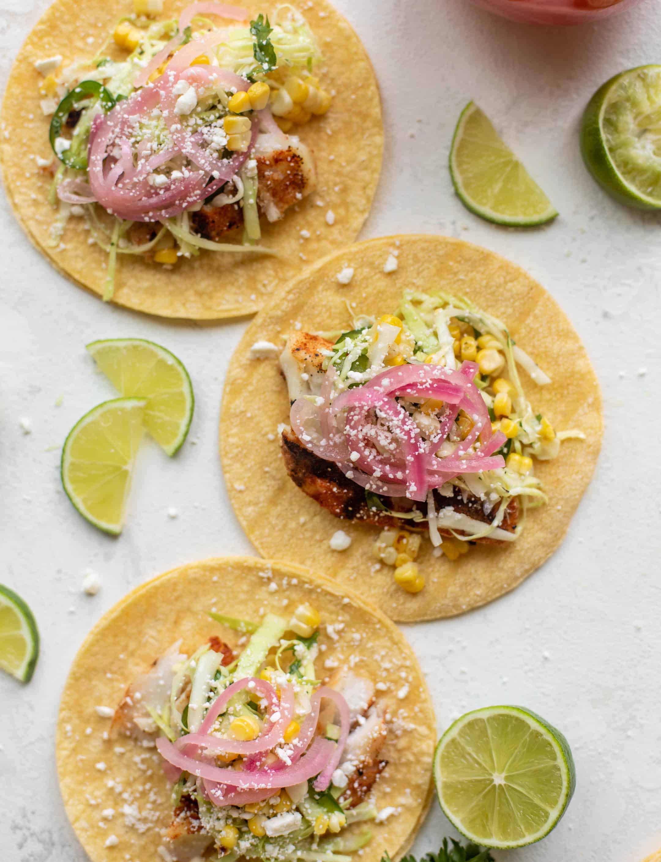 grilled fish tacos with jalapeño corn slaw