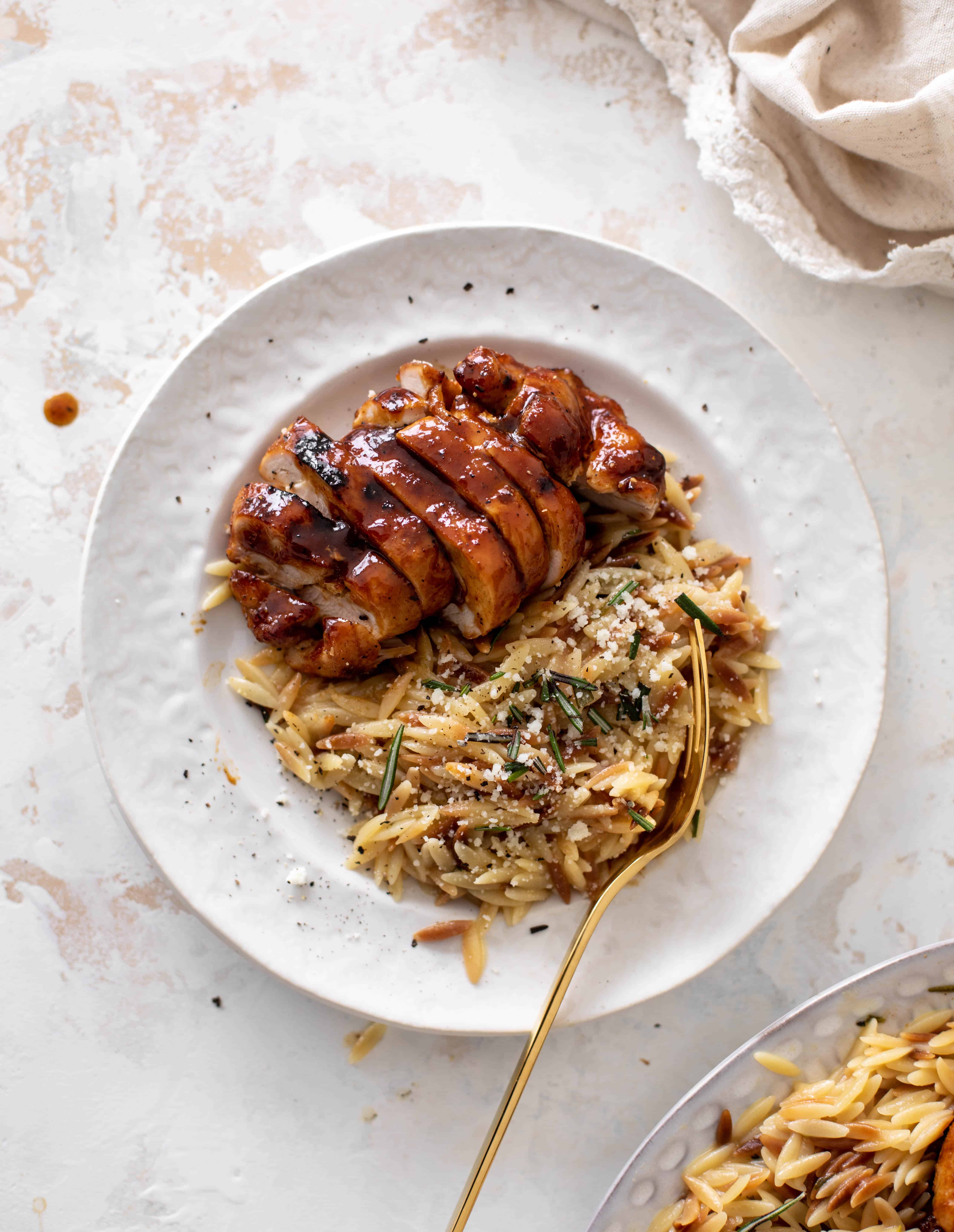 hot honey chicken thighs with rosemary orzo