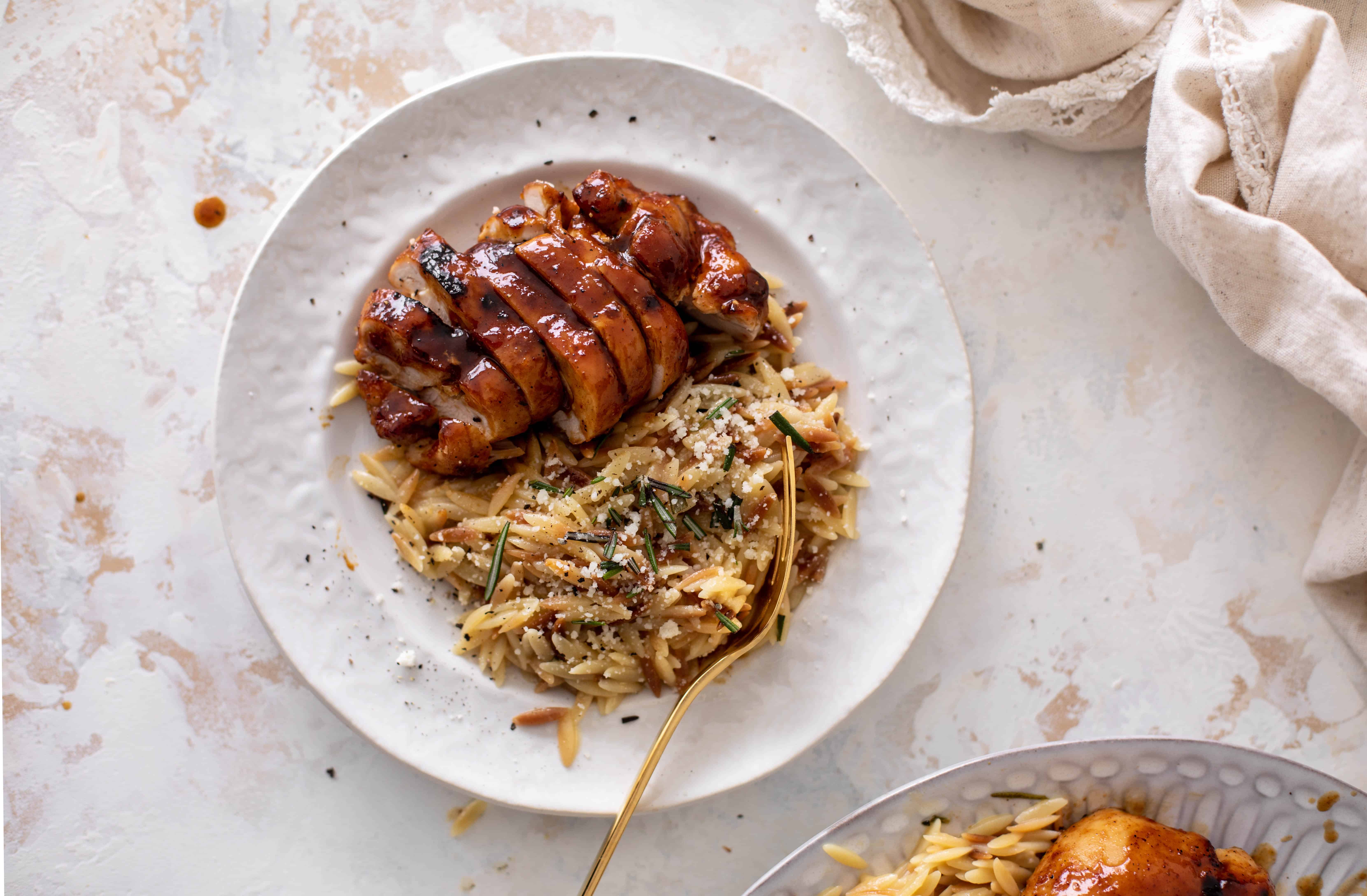 hot honey chicken thighs with rosemary orzo