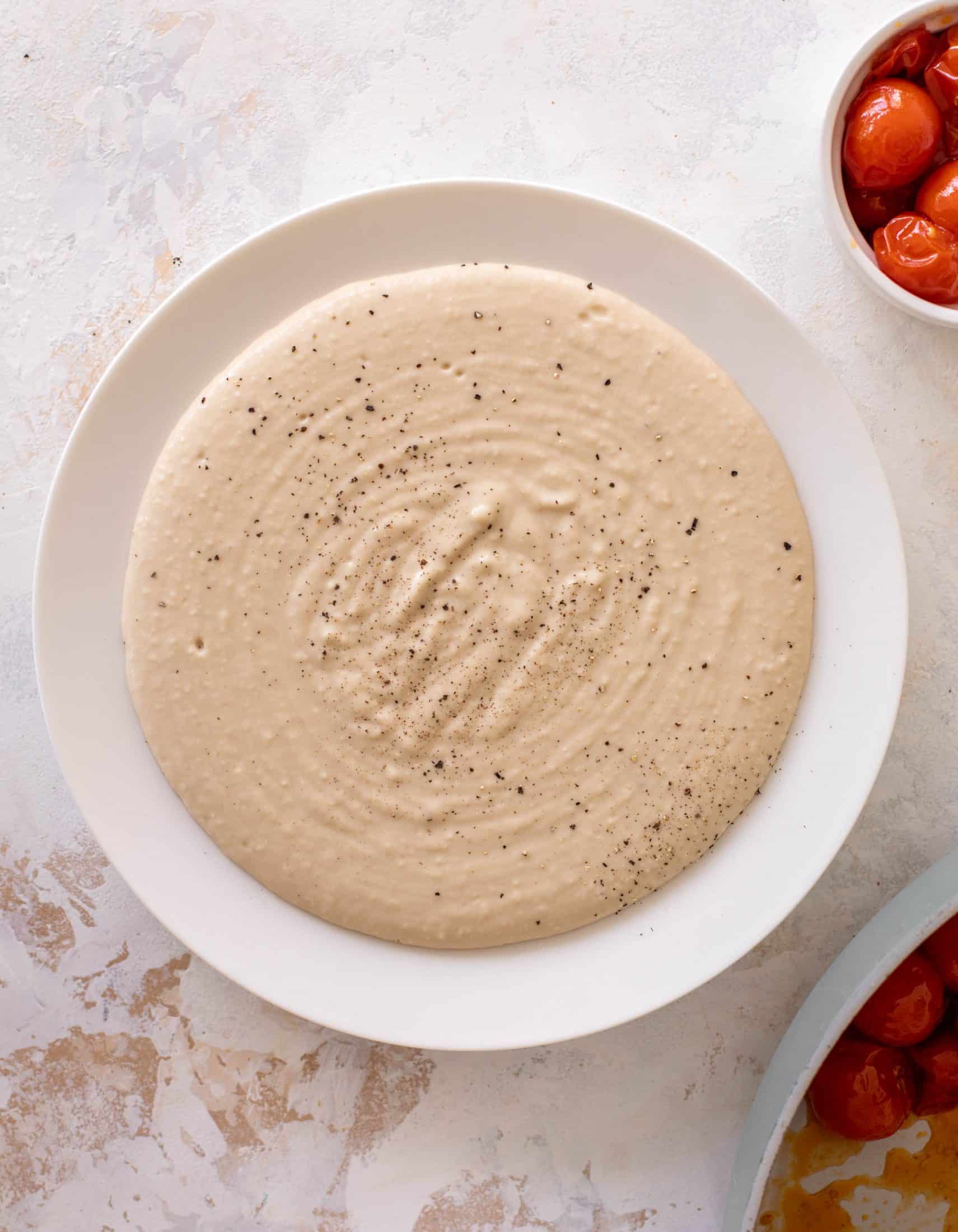 white bean dip with burst tomatoes