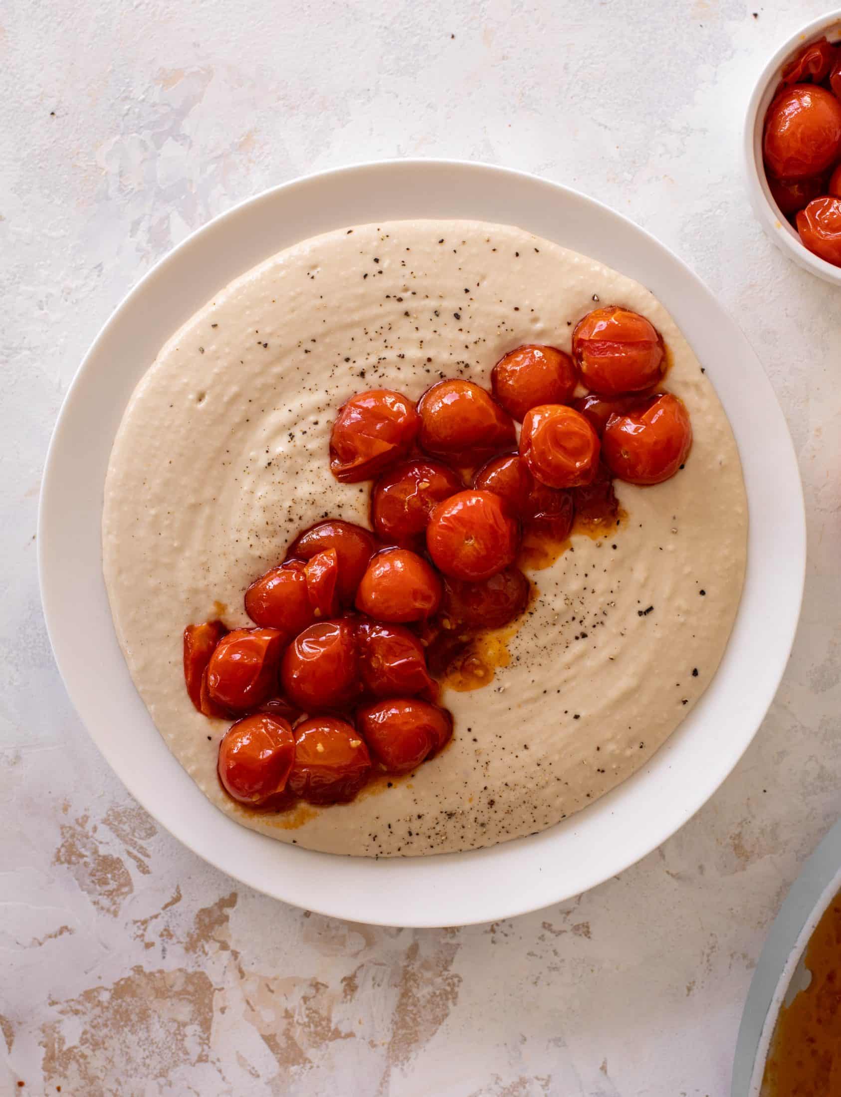white bean dip with burst tomatoes