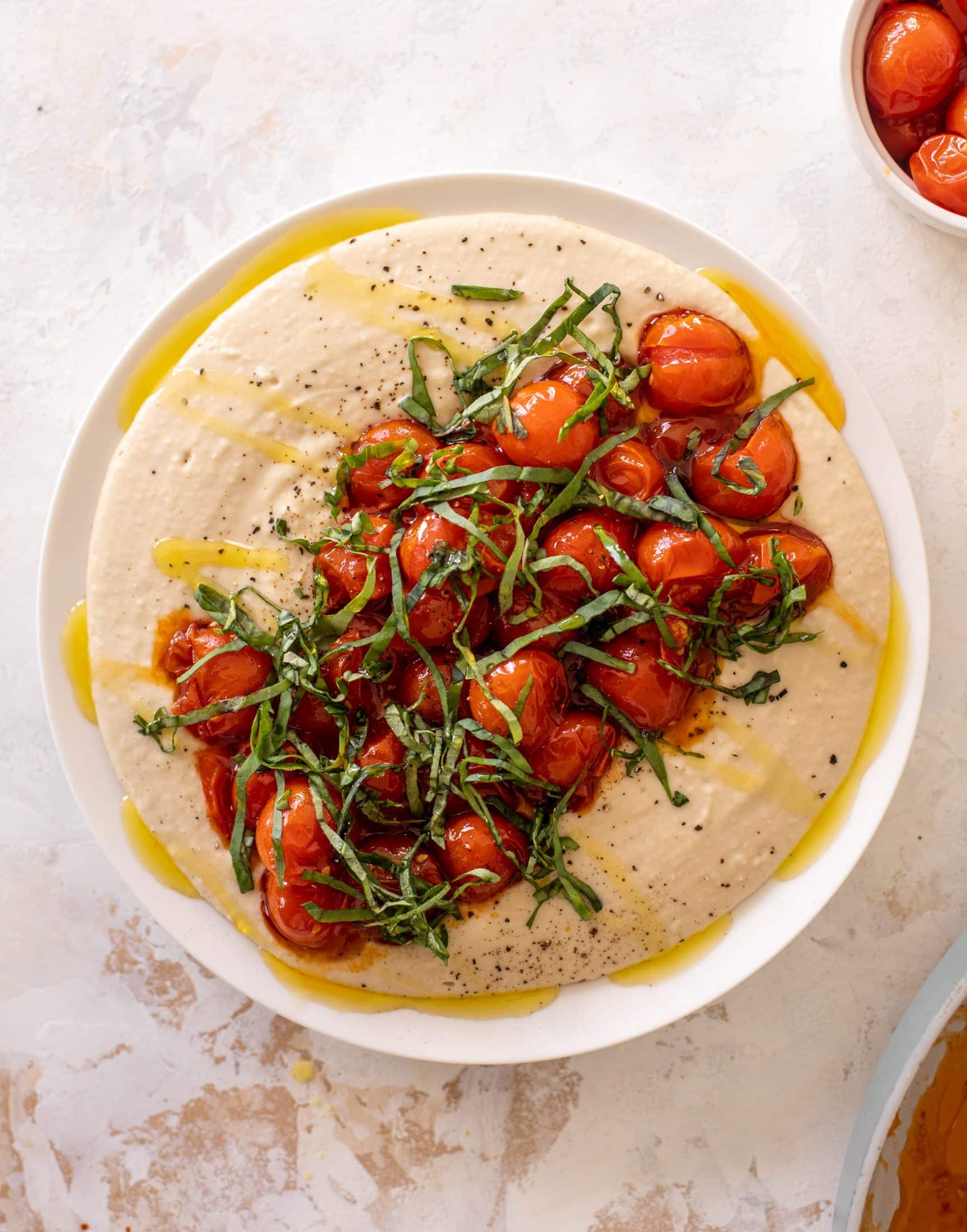 white bean dip with burst tomatoes